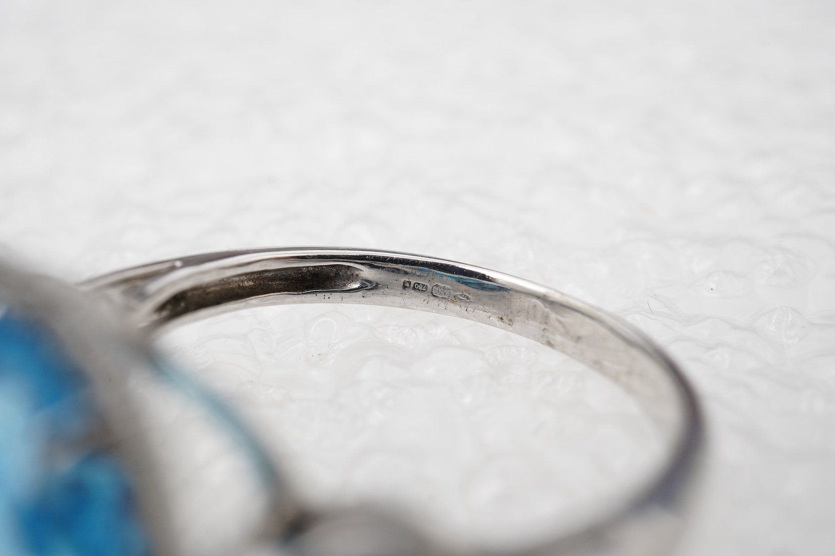 A blue topaz and diamond ring